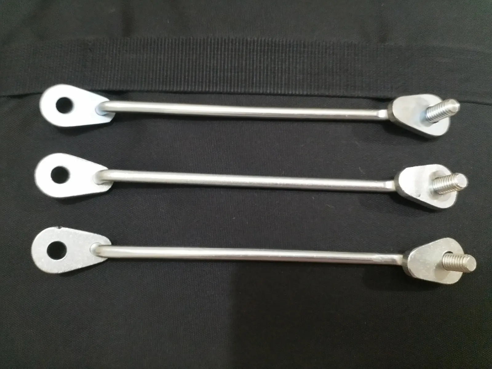 Zinc plated steel rods with an eye plate at one end and a threaded stud at the other